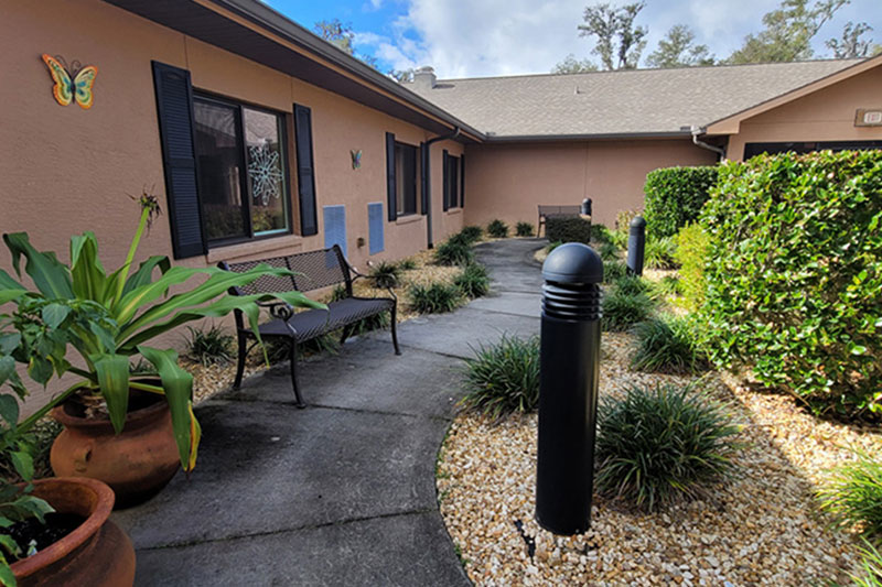 Exterior walkway through common area at Superior Residences of Lecanto
